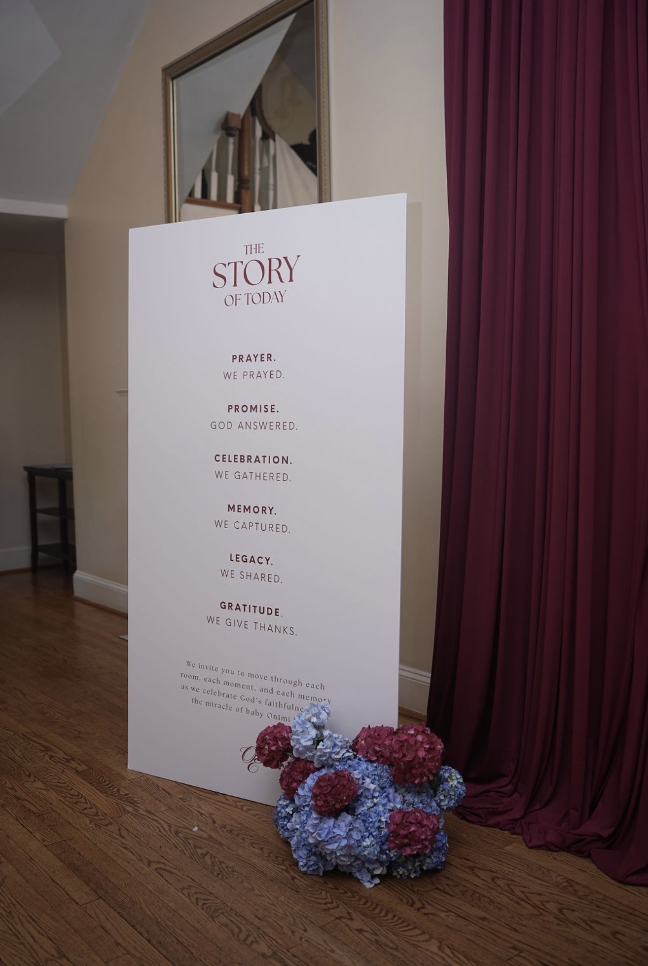 A tall printed sign titled The Story of Today, listing prayer, promise, celebration, memory, legacy and gratitude, set beside a cluster of blue and crimson hydrangeas.